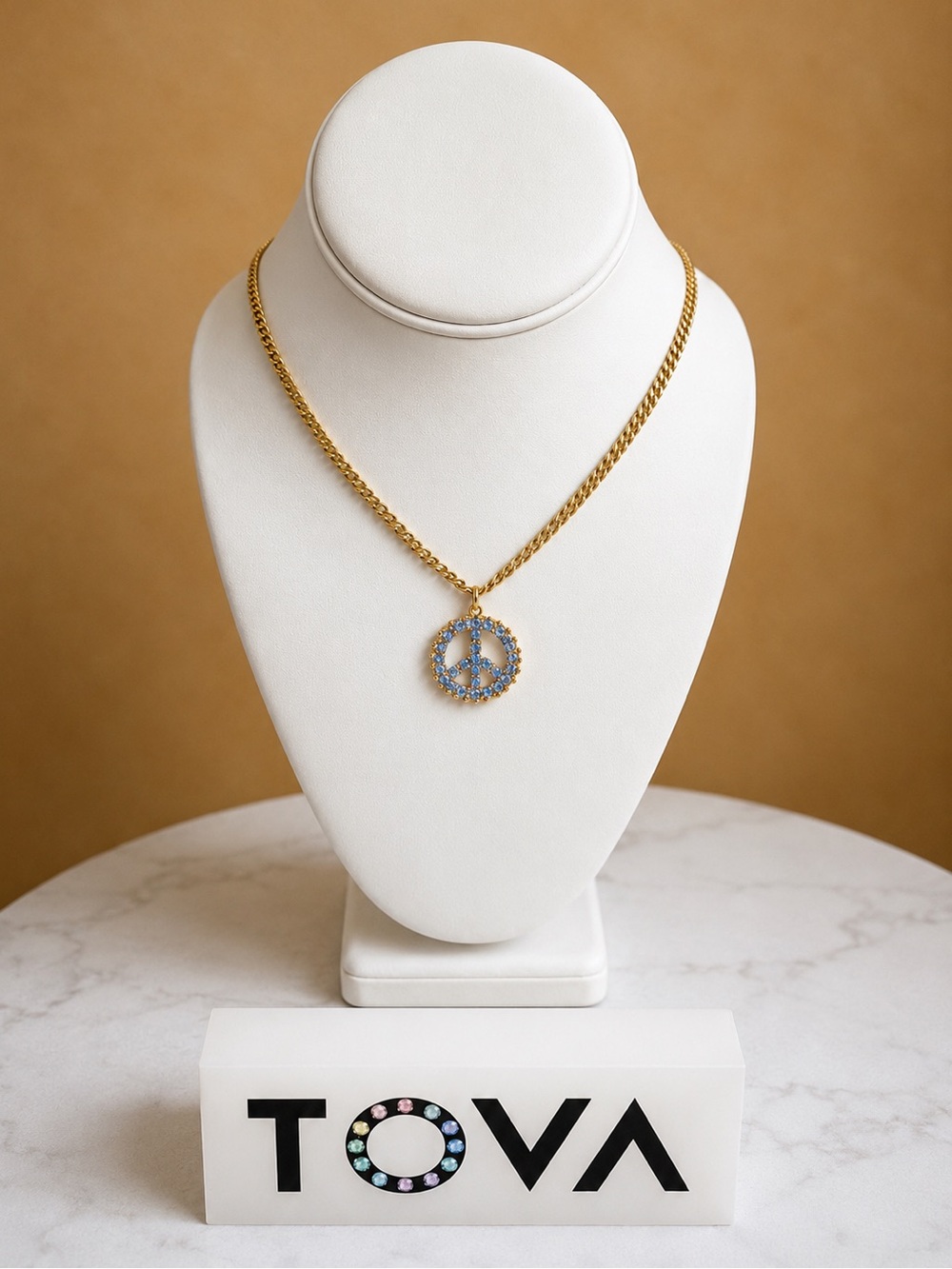Tova Peace ☮️ Saphire blue crystal
On a Gold Chain Necklace..